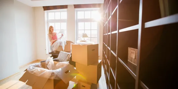 moving boxes in front of shelves